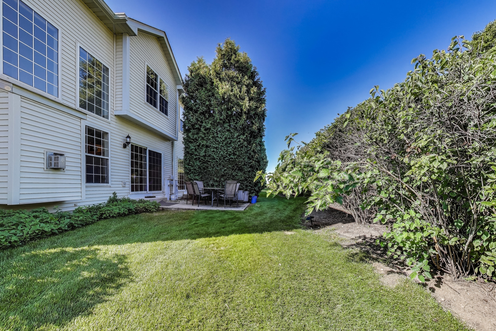 1086 Lily Field Lane Bolingbrook, IL 60440 - Photo 23 of 24 a view of a back yard of the house
