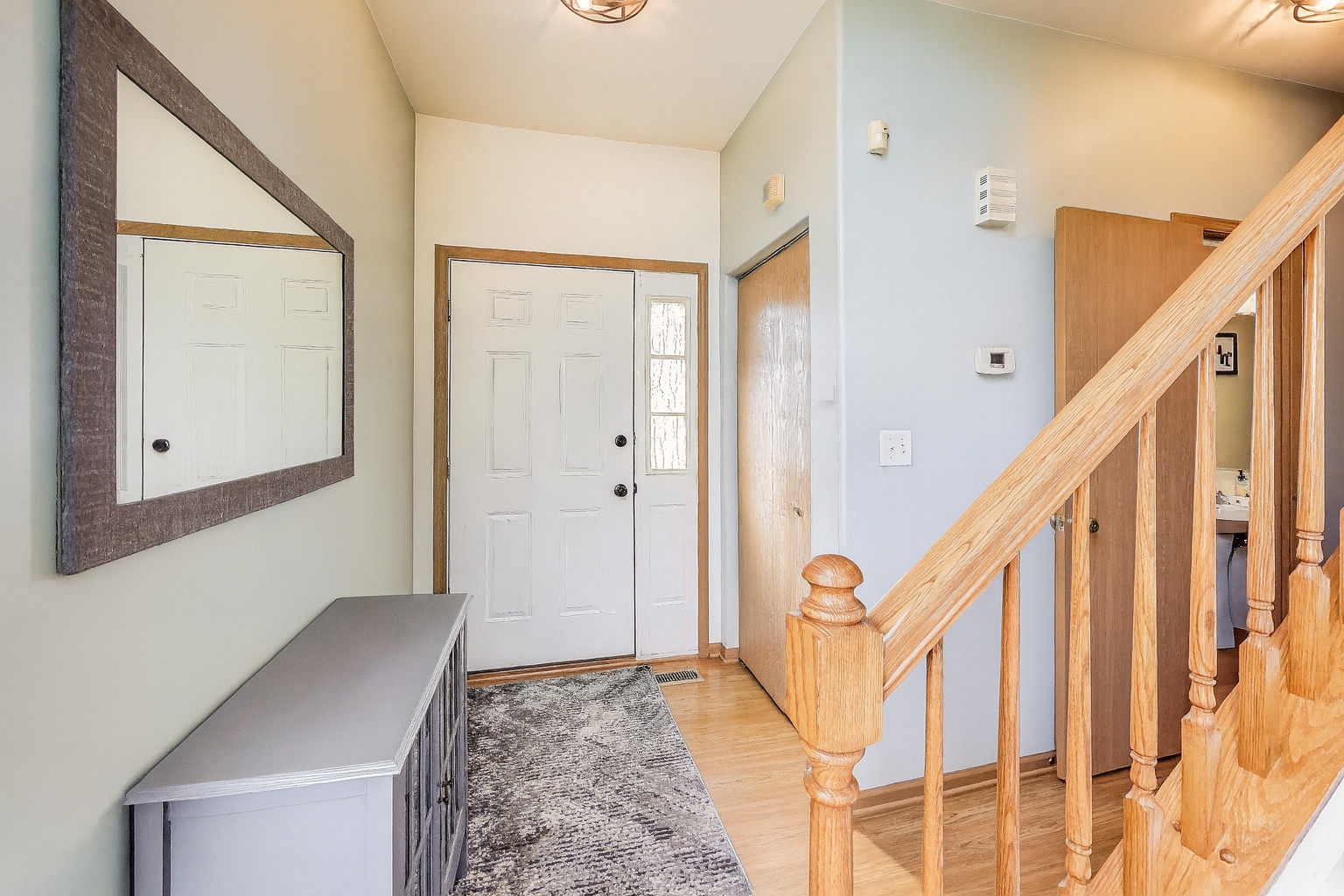 1086 Lily Field Lane Bolingbrook, IL 60440 - Photo 3 of 24 a view of an entryway with wooden floor