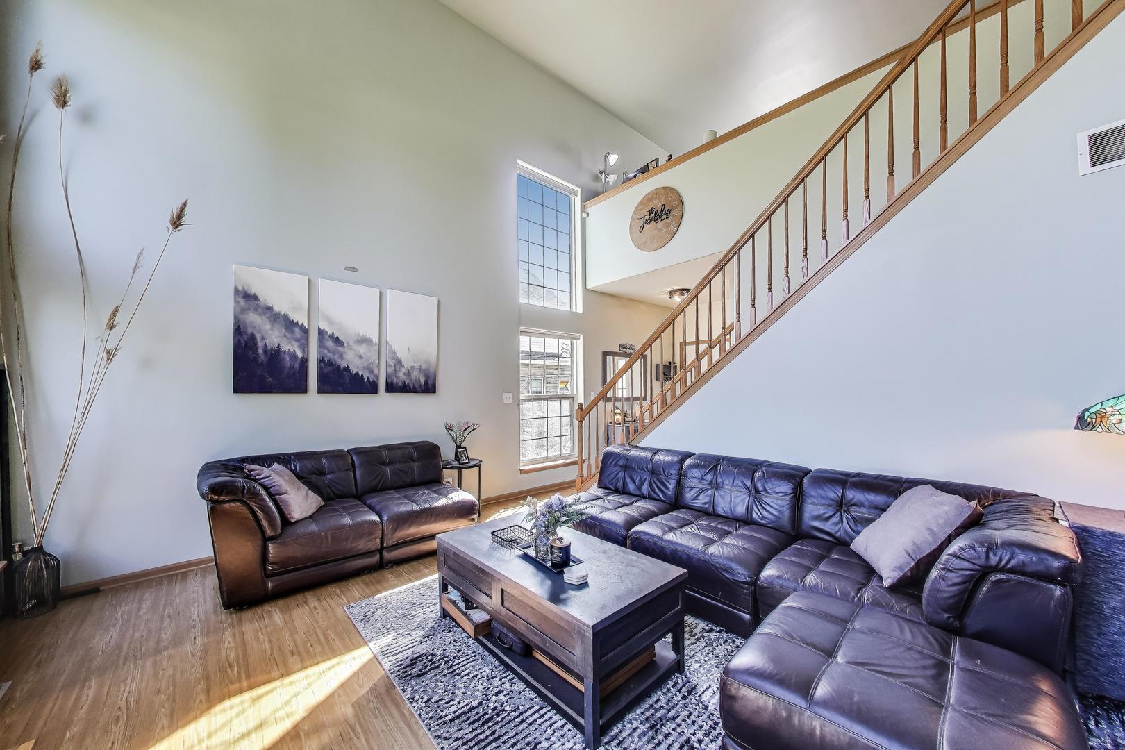 1086 Lily Field Lane Bolingbrook, IL 60440 - Photo 6 of 24 a living room with furniture and stairs