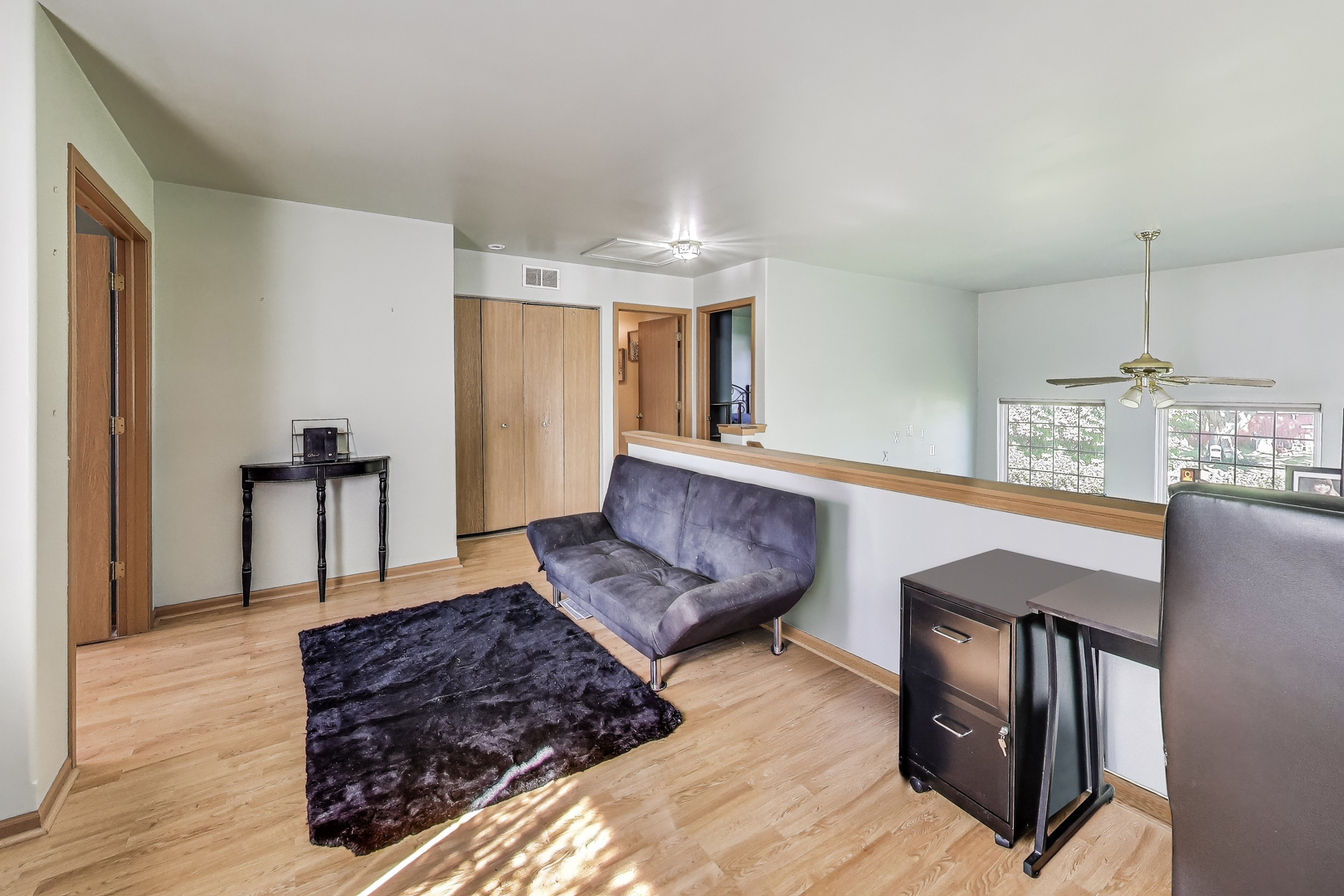 1086 Lily Field Lane Bolingbrook, IL 60440 - Photo 10 of 24 a living room with furniture rug and wooden floor