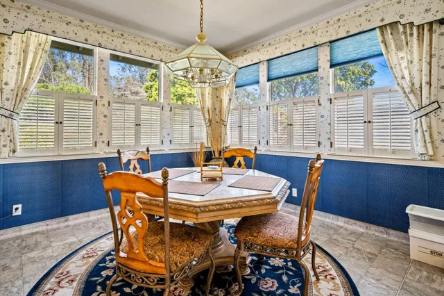 a view of a dining room with furniture window and outside view