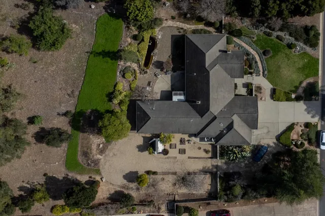 an aerial view of multiple houses with outdoor space