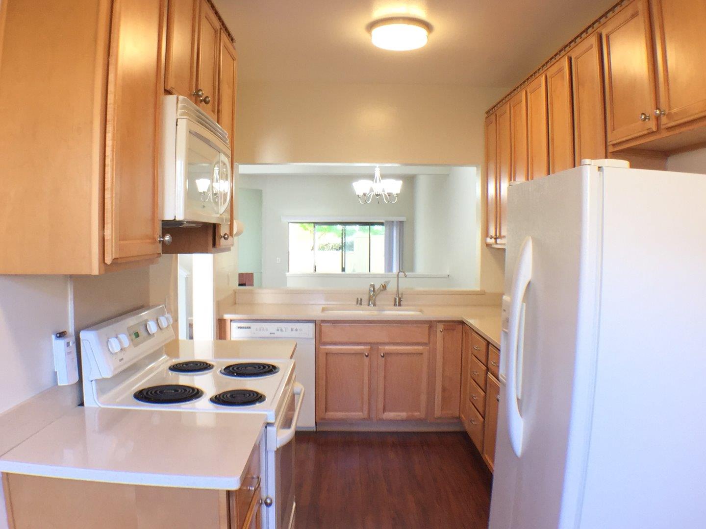 102 Marylinn Drive Milpitas, CA 95035 - Photo 5 of 18 a kitchen with a sink a refrigerator and window