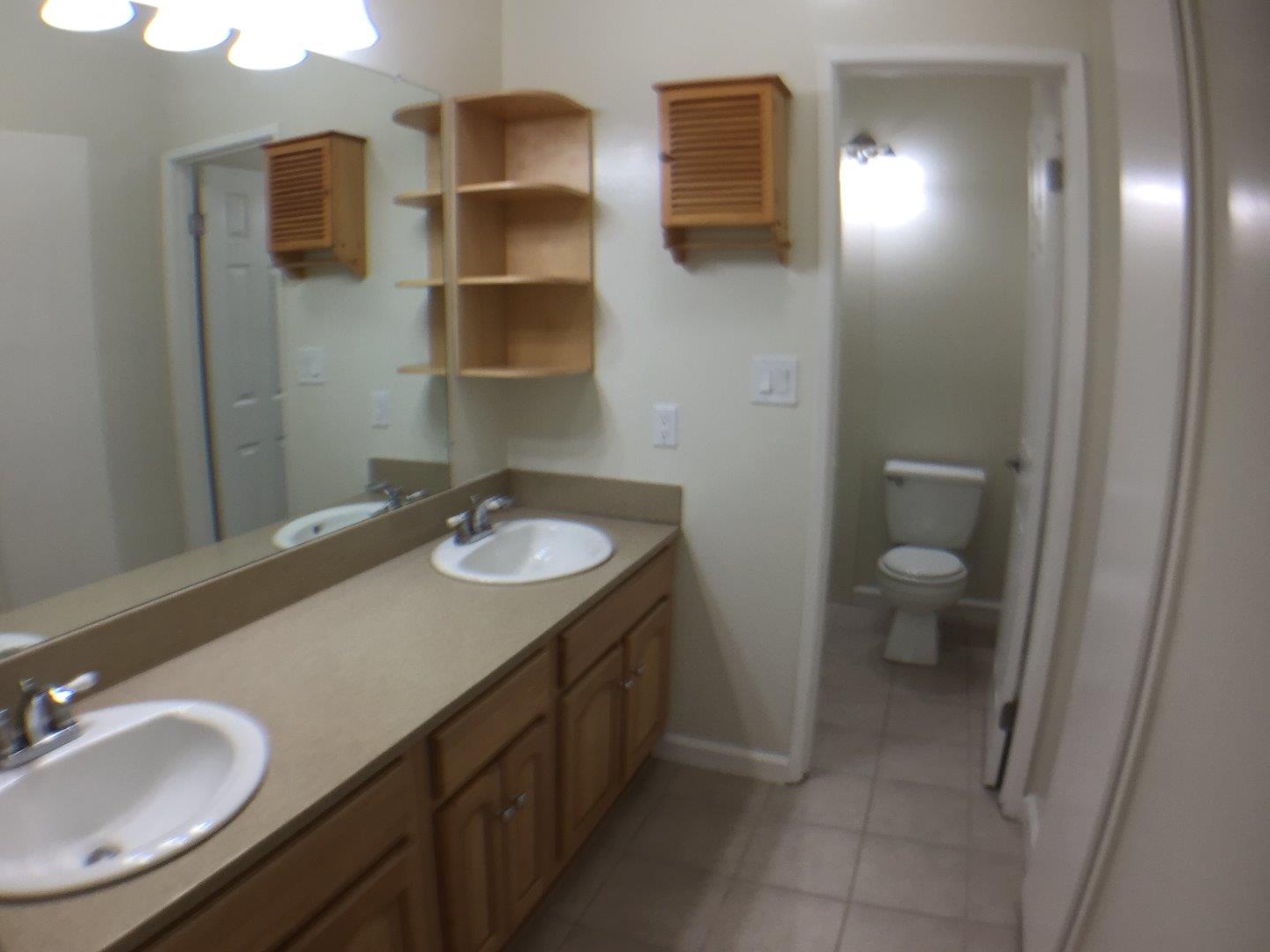 102 Marylinn Drive Milpitas, CA 95035 - Photo 10 of 18 a bathroom with a sink and a mirror