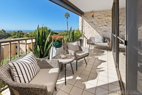 a view of balcony with furniture