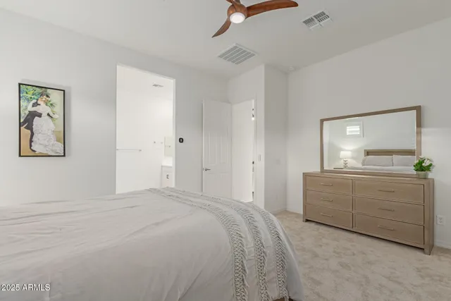 a bathroom with double sink and a mirror