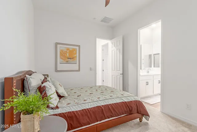 a bathroom with double vanity sinks a vanity and a mirror