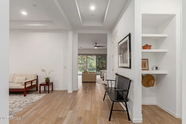 a living room with furniture rug and window
