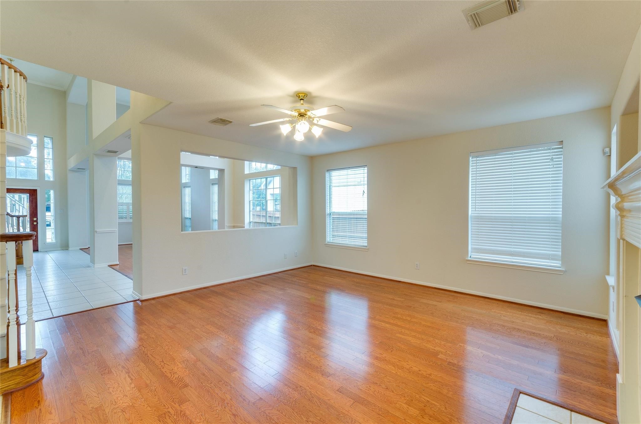 4019 Angel Spring Drive Sugar Land, TX 77479 - Photo 13 of 50 a view of an empty room with window and wooden floor