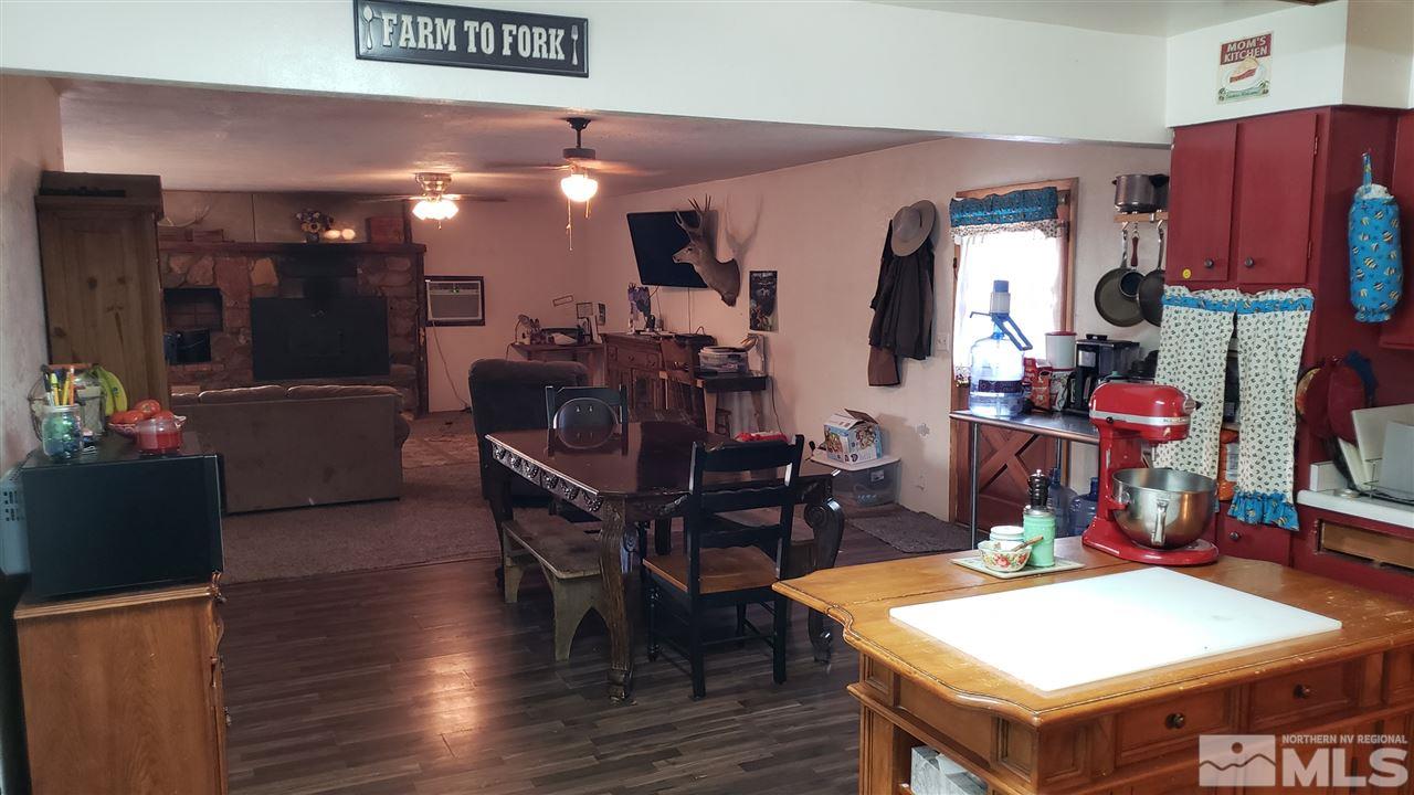 1505 Soda Lake Road Fallon, NV 89406 - Photo 12 of 31 a view of a dining room with furniture and wooden floor
