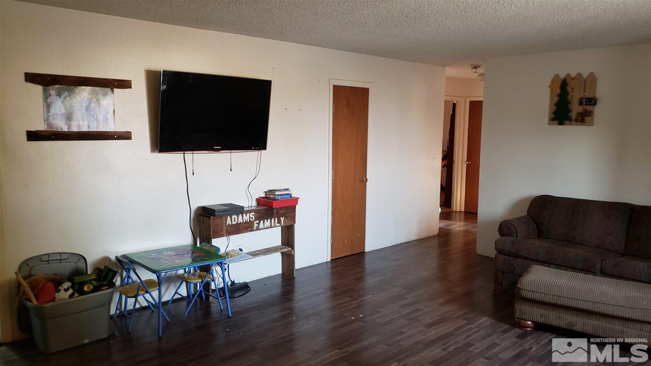 1505 Soda Lake Road Fallon, NV 89406 - Photo 19 of 31 a living room with furniture and a flat screen tv