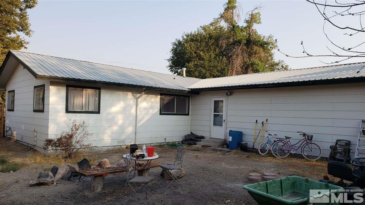 1505 Soda Lake Road Fallon, NV 89406 - Photo 6 of 31 a backyard of a house with fire pit and chairs