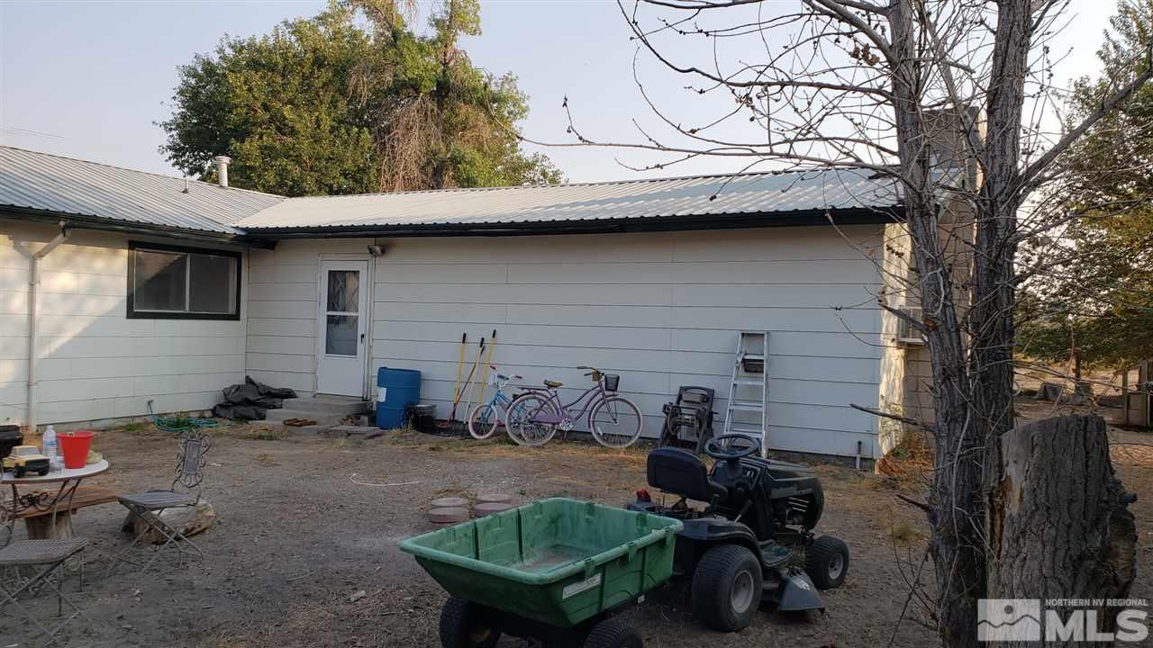 1505 Soda Lake Road Fallon, NV 89406 - Photo 7 of 31 a backyard of a house with table and chairs