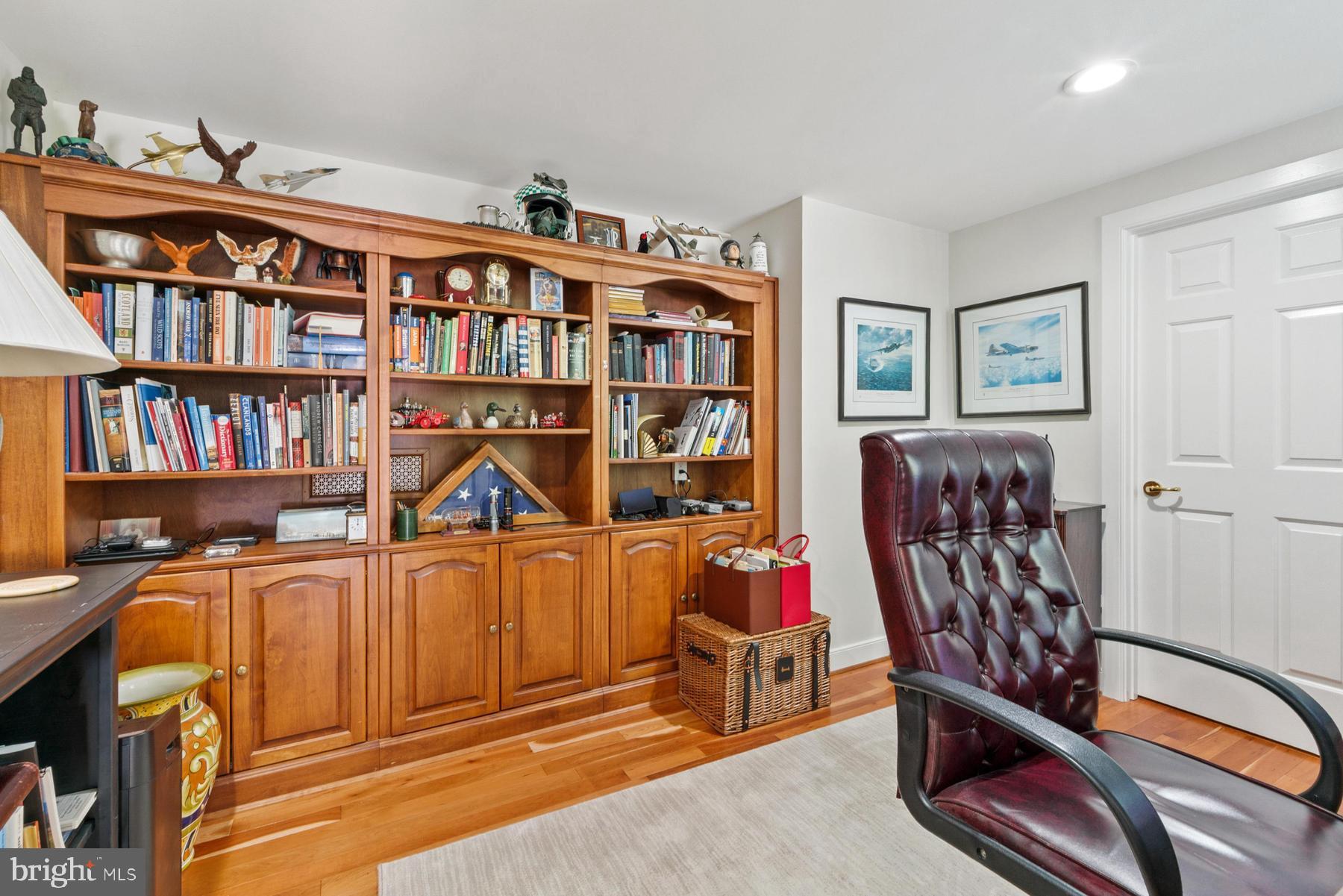 8095 Church Neck Road St. Michaels, MD 21663 - Photo 20 of 48 a view of a workspace with furniture and book shelf