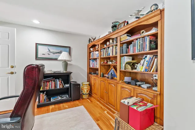 a living room with lots of furniture and baby book shelf