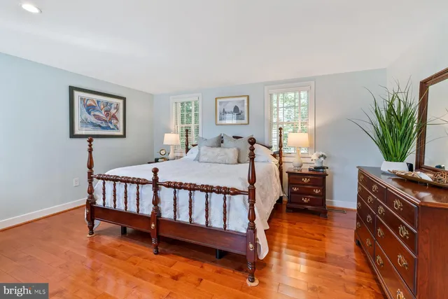 a bed room with a bed and a window