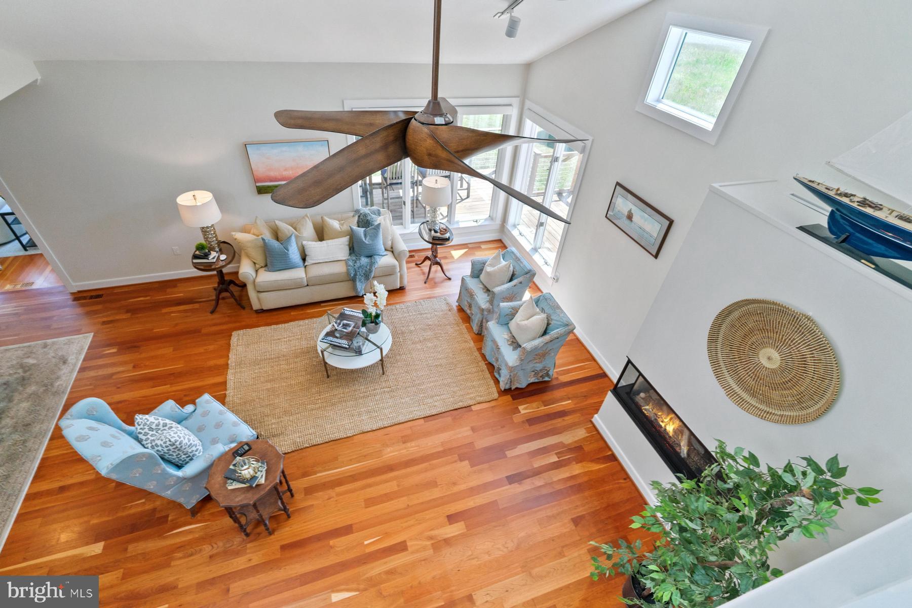8095 Church Neck Road St. Michaels, MD 21663 - Photo 27 of 48 a living room with furniture and flowers