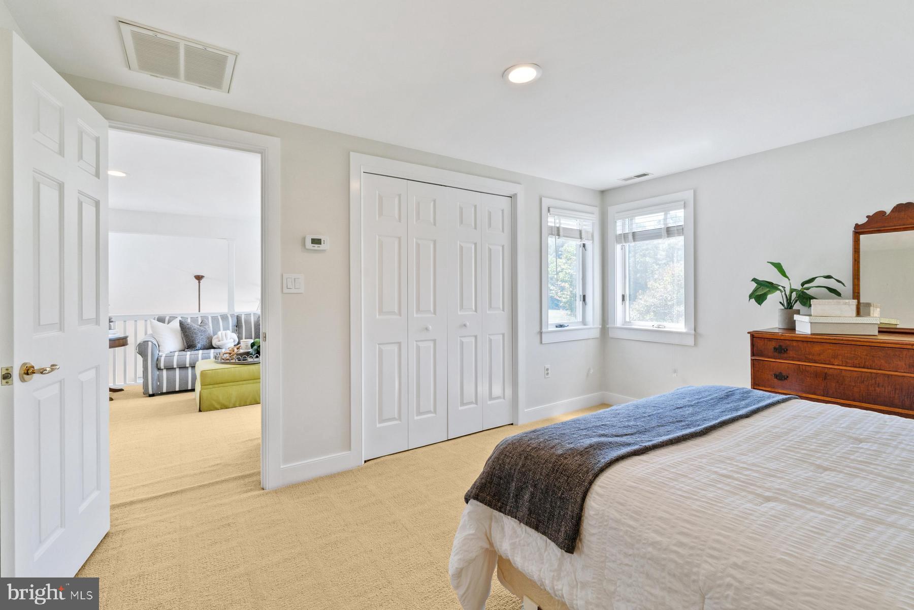 8095 Church Neck Road St. Michaels, MD 21663 - Photo 30 of 48 a bedroom with a bed and a couch