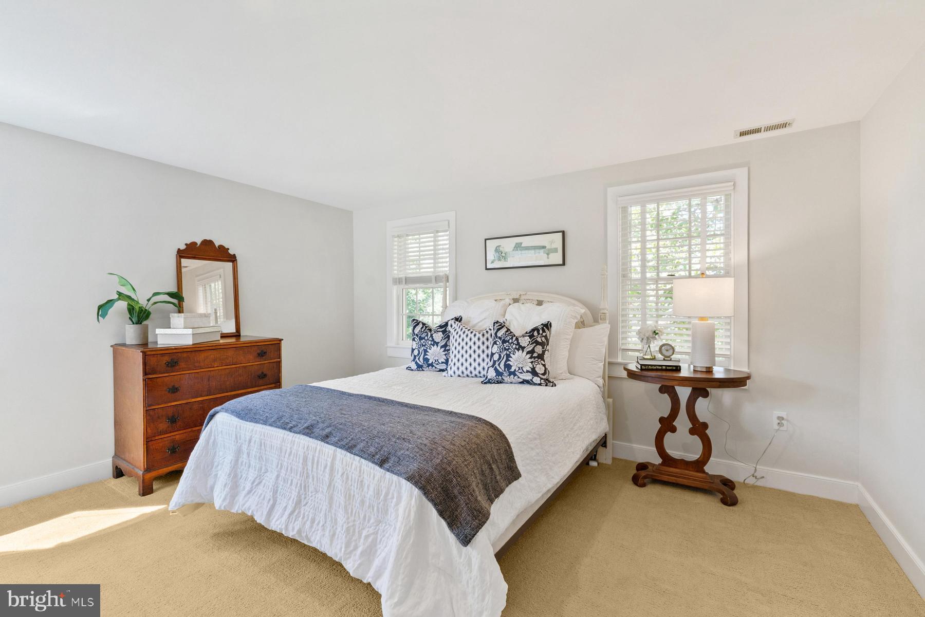 8095 Church Neck Road St. Michaels, MD 21663 - Photo 31 of 48 a bedroom with a bed and a table