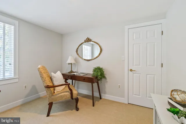 a dining room with furniture and a window
