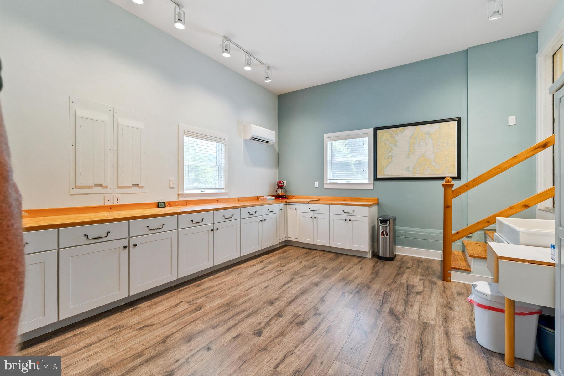8095 Church Neck Road St. Michaels, MD 21663 - Photo 36 of 48 a kitchen with sink cabinets and wooden floor
