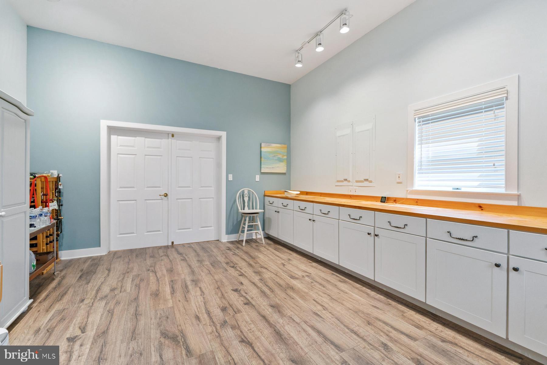8095 Church Neck Road St. Michaels, MD 21663 - Photo 37 of 48 a spacious bathroom with a sink and a mirror