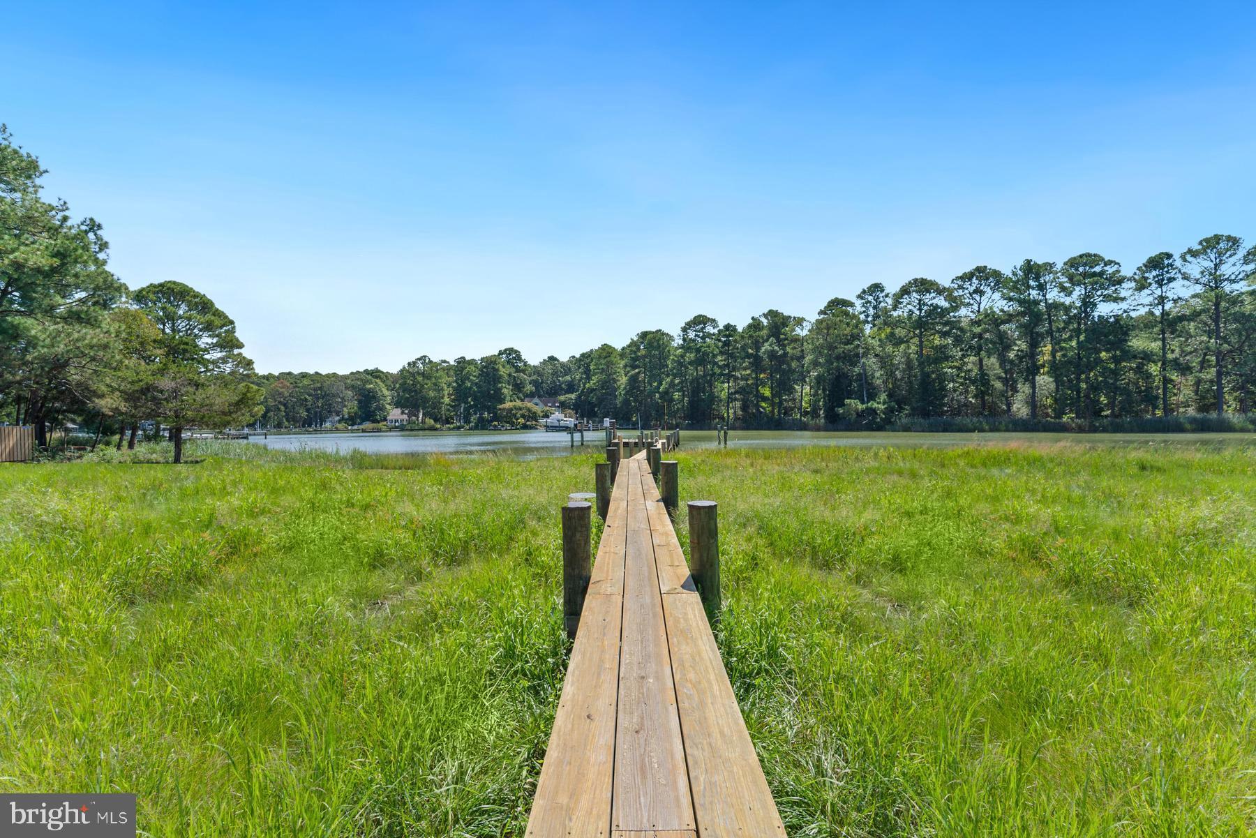 8095 Church Neck Road St. Michaels, MD 21663 - Photo 43 of 48 a view of a garden with a lake