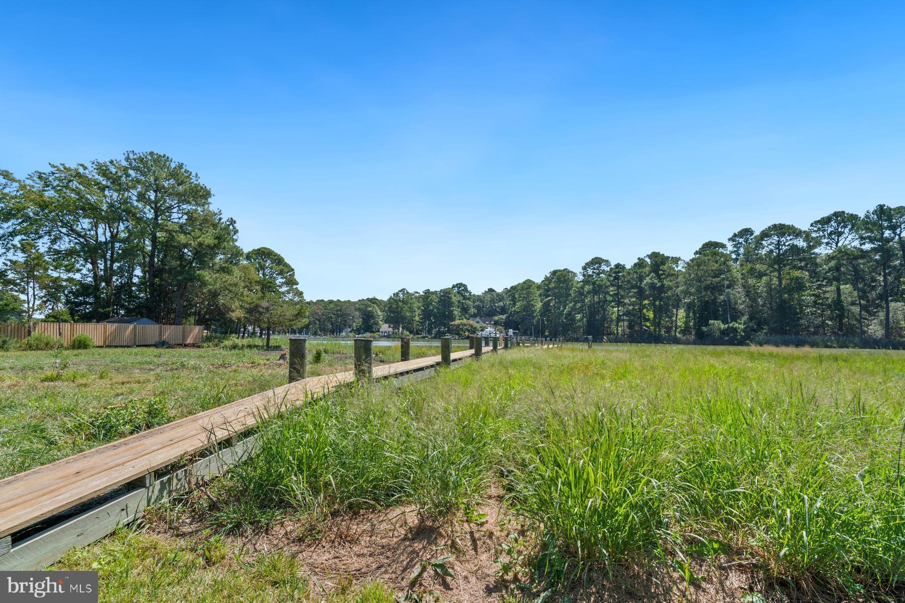 8095 Church Neck Road St. Michaels, MD 21663 - Photo 44 of 48 a view of a lake with a big yard