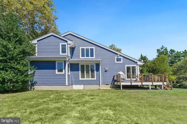 an aerial view of a houses with a lake view