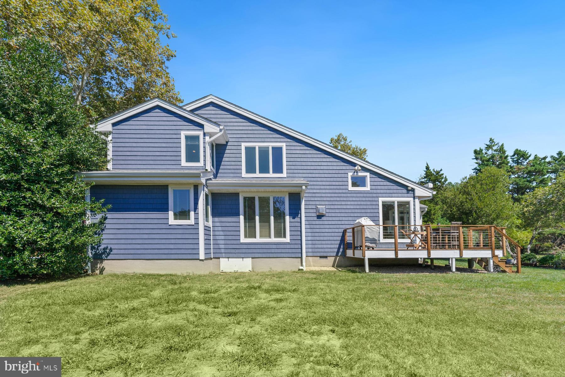 8095 Church Neck Road St. Michaels, MD 21663 - Photo 47 of 48 a front view of a house with a garden