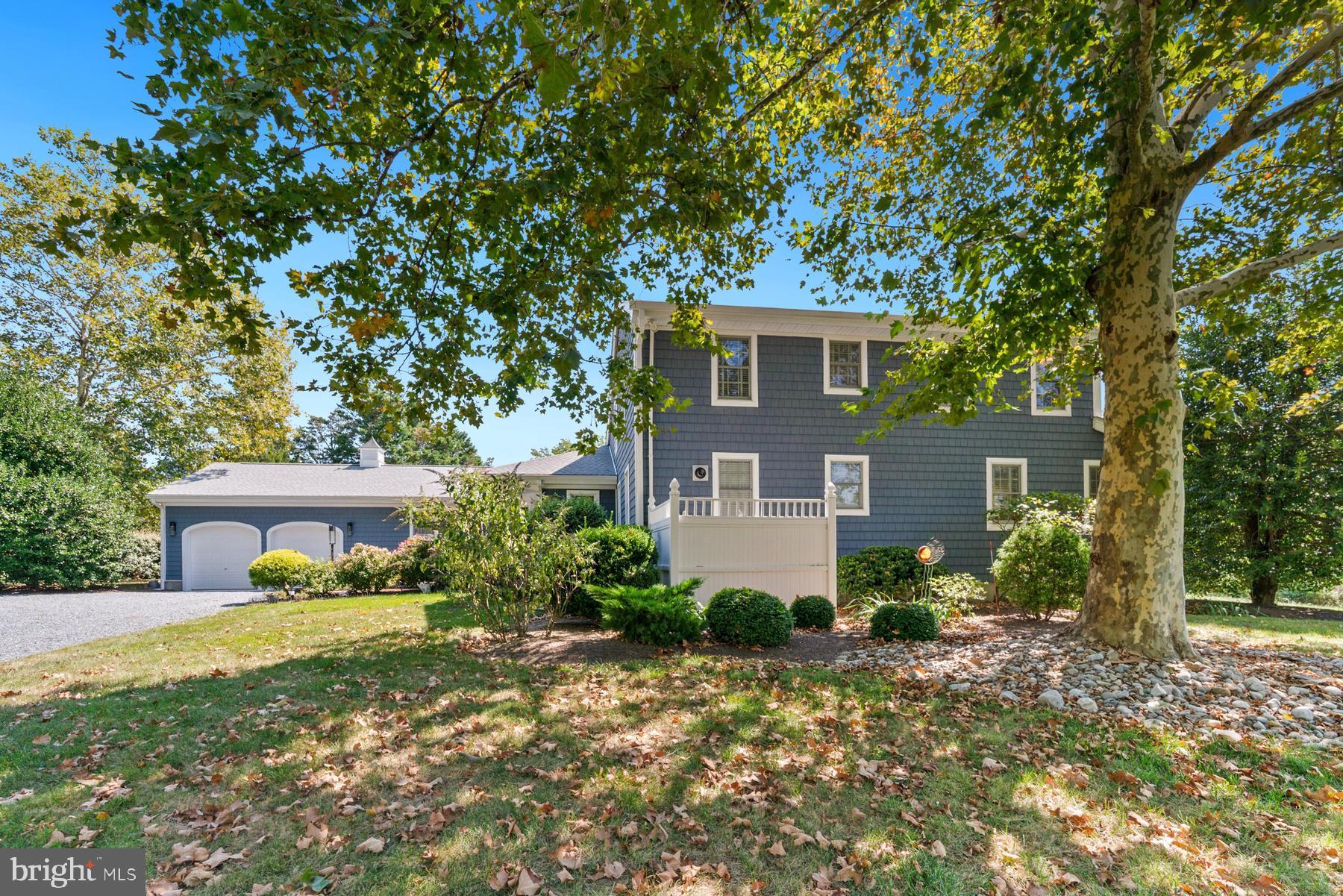 8095 Church Neck Road St. Michaels, MD 21663 - Photo 7 of 48 a front view of a house with garden