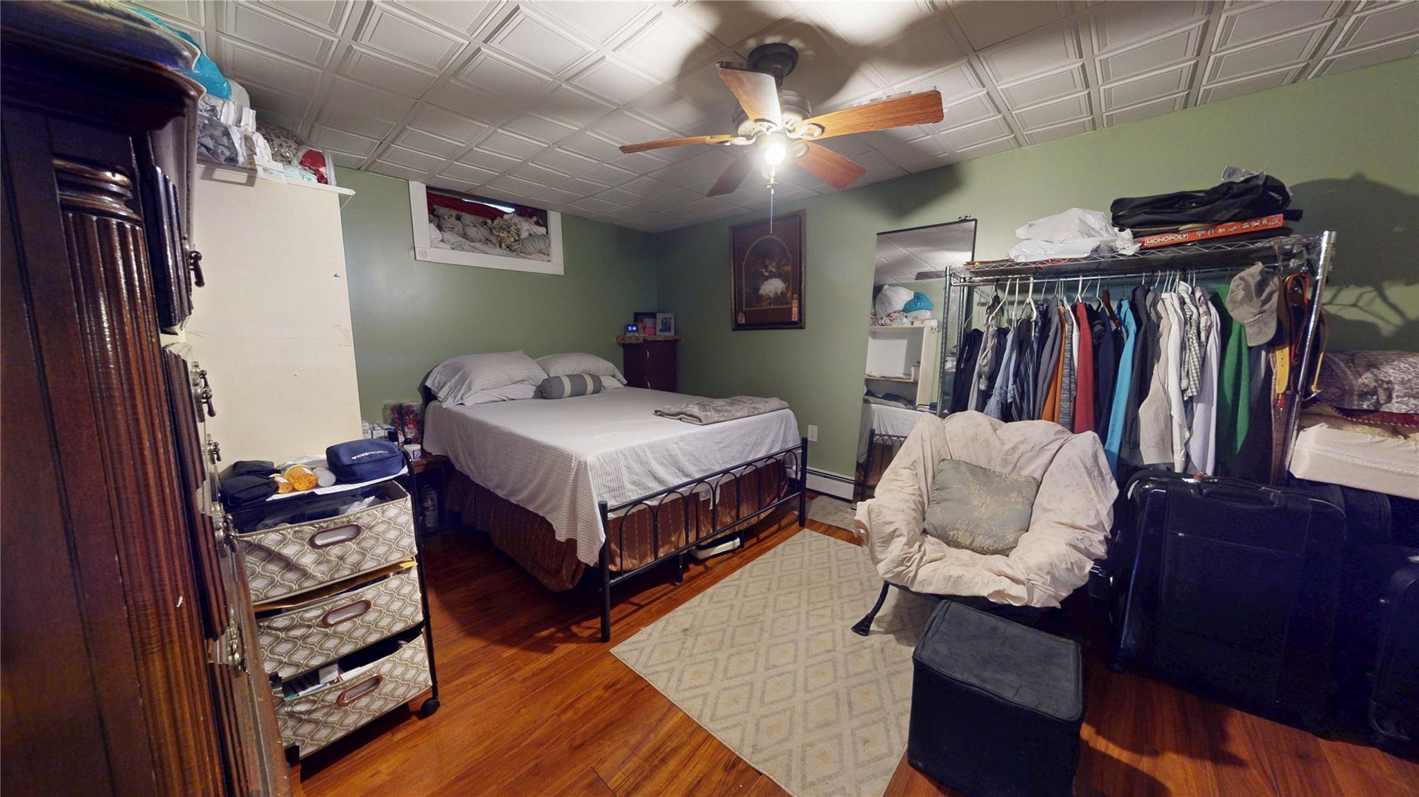 31-06 Healy Avenue Queens, NY 11691 - Photo 30 of 34 Bedroom with wood finished floors, ceiling fan, and a closet