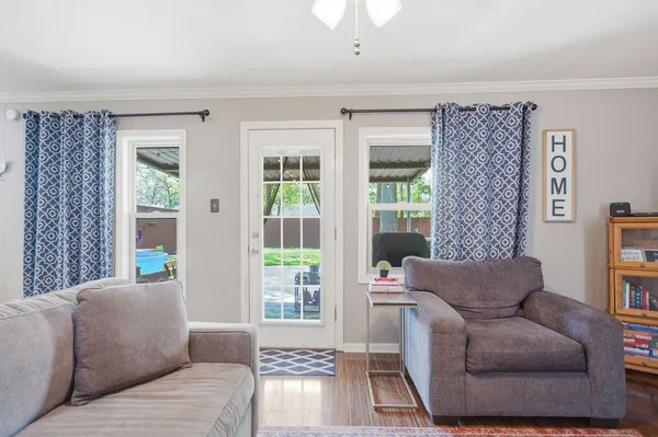 a living room with furniture and a window