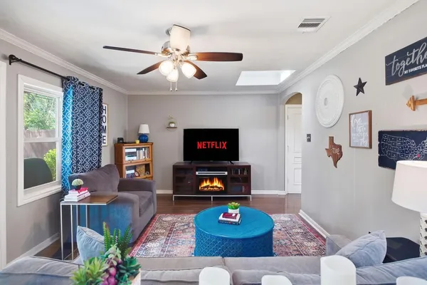 a living room with furniture and a flat screen tv
