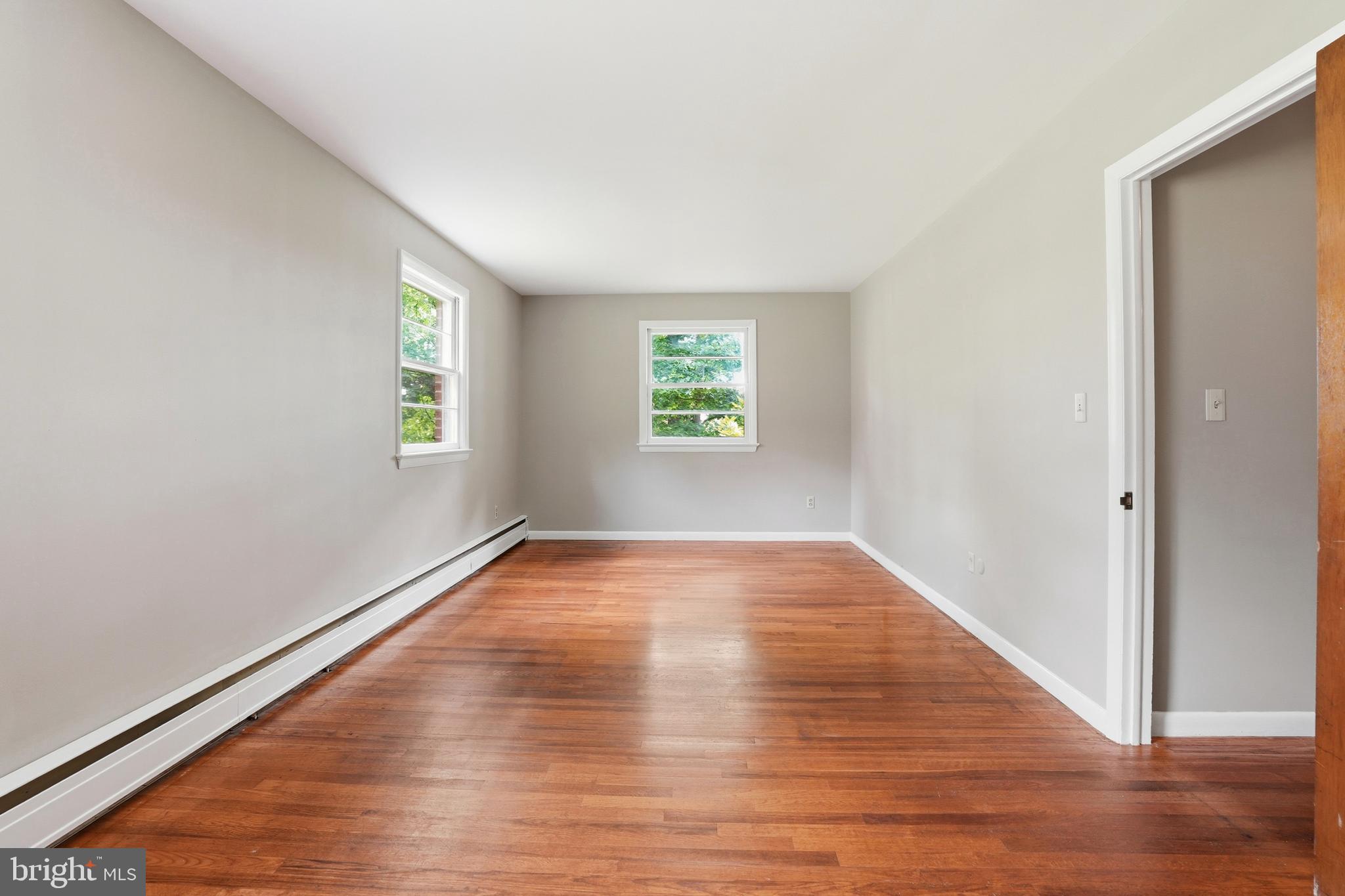 486 Derstine Road Hatfield, PA 19440 - Photo 22 of 53 a view of an empty room with wooden floor and a window
