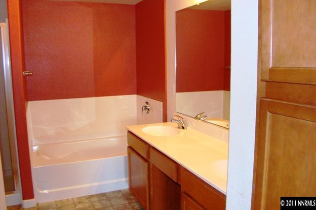 9050 Double R Boulevard, Unit 711 Reno, NV 89521 - Photo 11 of 13 a bathroom with a tub and a sink