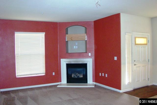 9050 Double R Boulevard, Unit 711 Reno, NV 89521 - Photo 6 of 13 a view of a livingroom with a fireplace and window