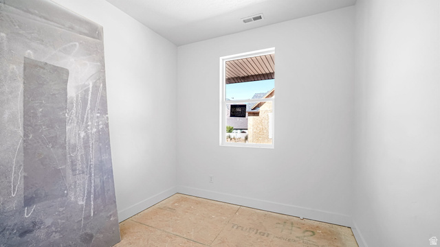 717 South Harrison Drive West Springville, UT 84663 - Photo 19 of 31 Bright interior room featuring a single window, white walls, and unfinished subflooring