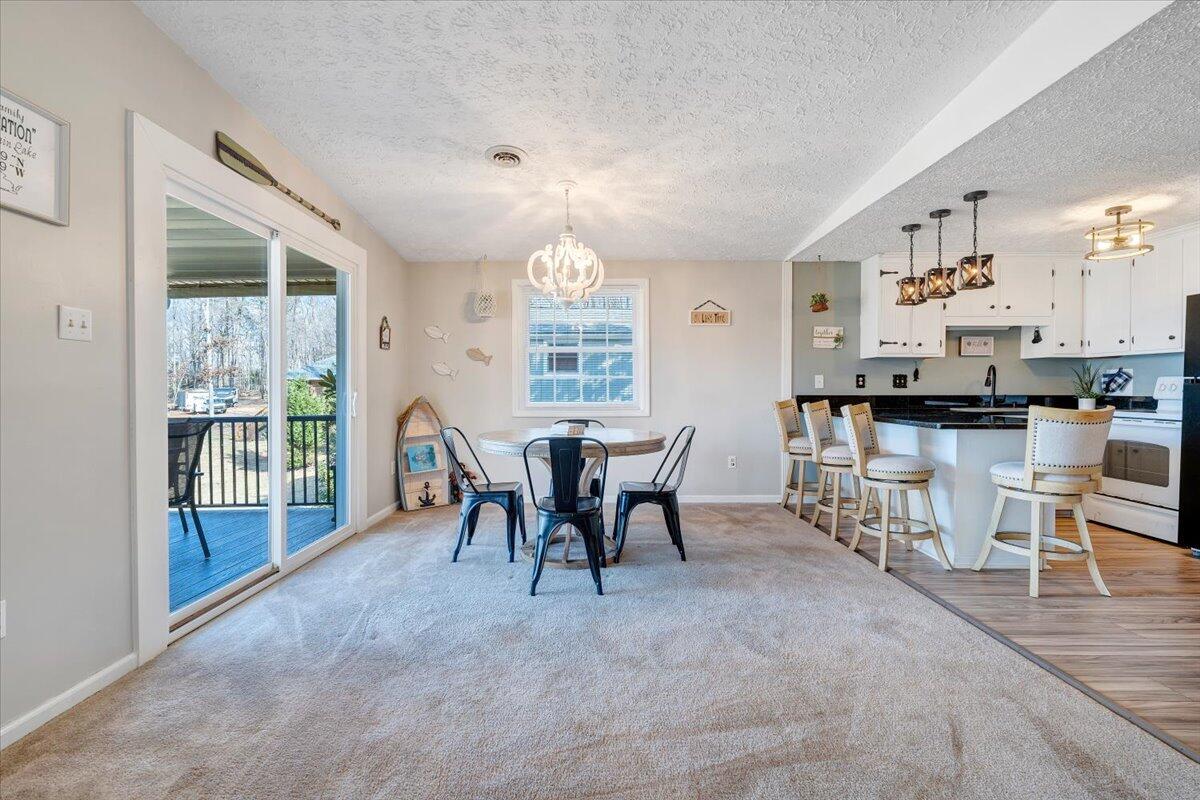 1111 Jefferson Dock Road Penhook, VA 24137 - Photo 16 of 50 a view of a dining room with furniture window and outside view