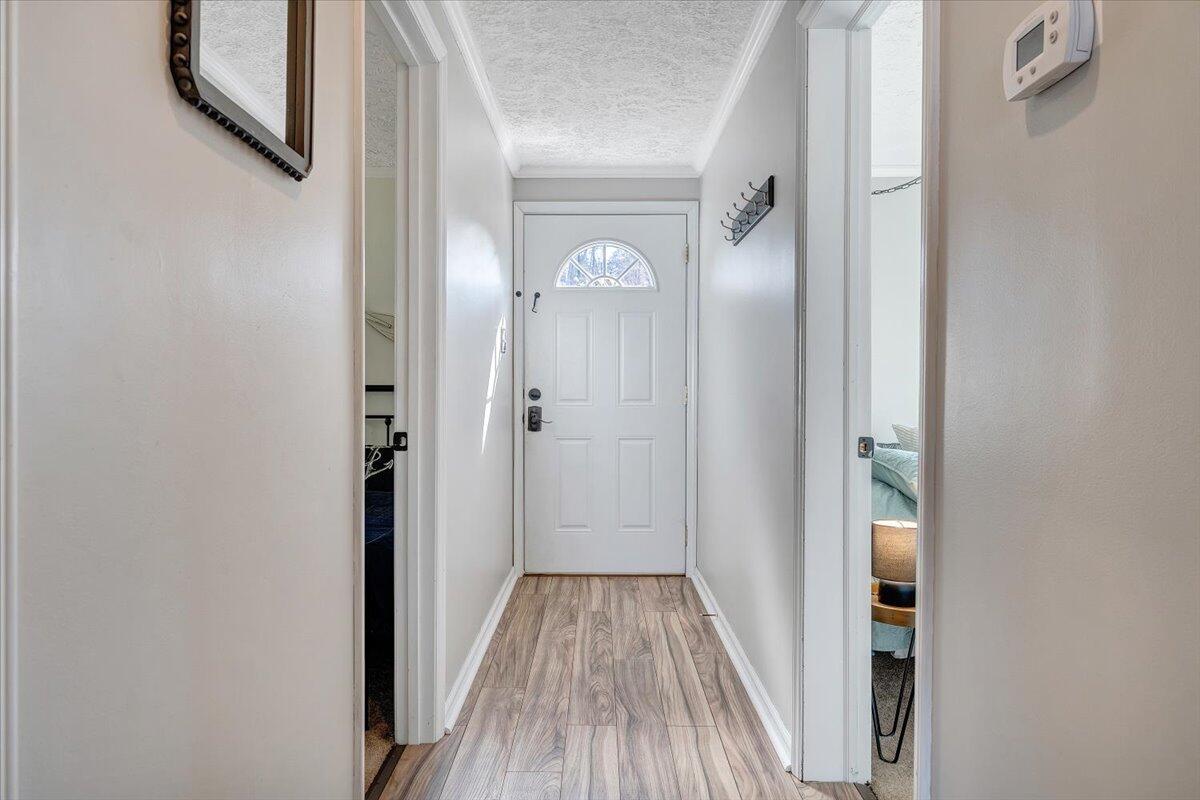 1111 Jefferson Dock Road Penhook, VA 24137 - Photo 7 of 50 a view of a hallway with wooden floor and closet