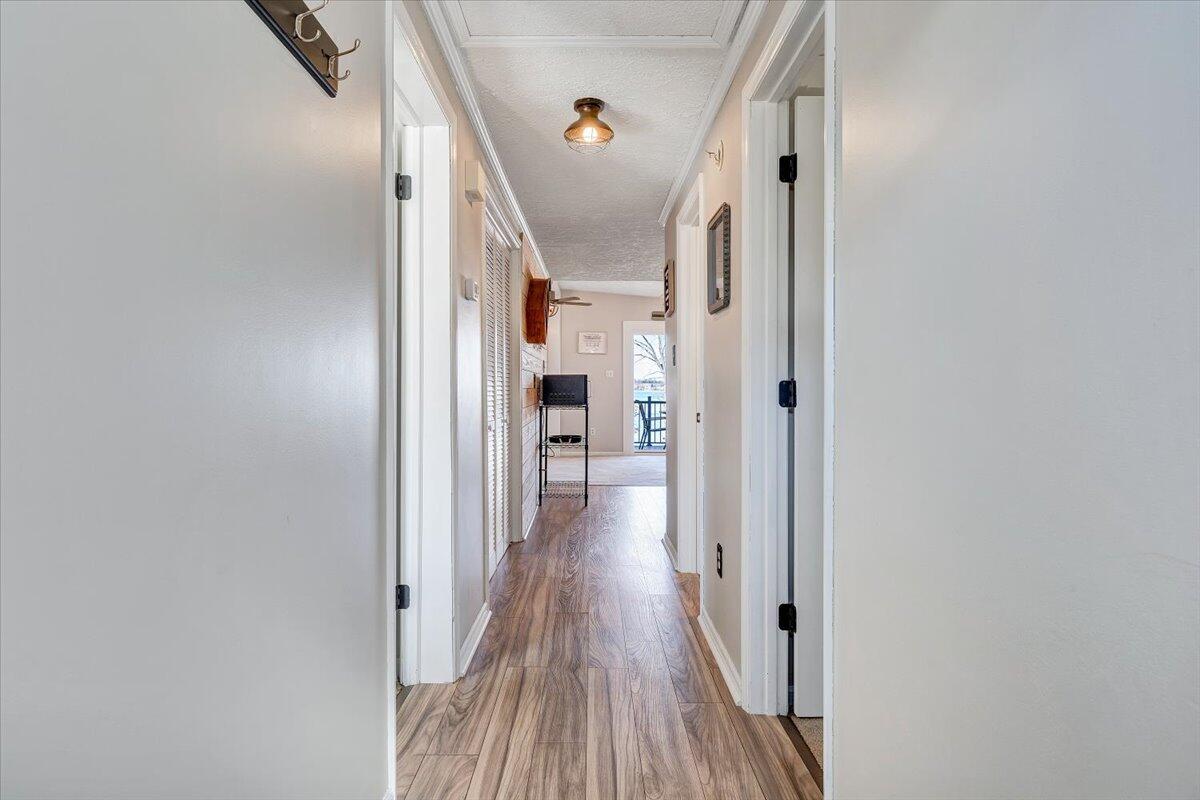 1111 Jefferson Dock Road Penhook, VA 24137 - Photo 9 of 50 a view of a hallway with wooden floor and staircase
