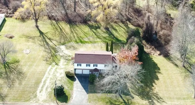 a aerial view of a house with swimming pool