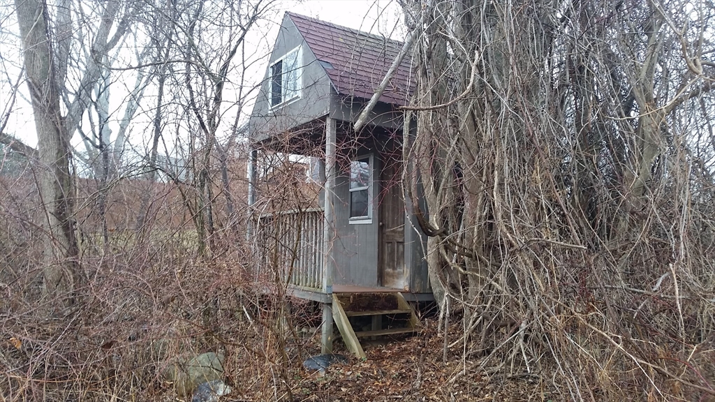 21 Fred Jackson Road Southwick, MA 01077 - Photo 32 of 35 a backyard of a house with chairs and wooden fence
