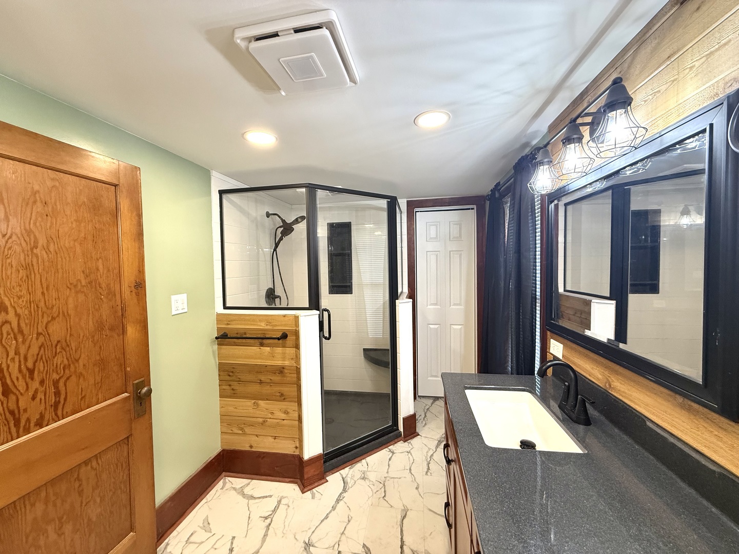 4799 South Center Road Rochelle, IL 61068 - Photo 17 of 30 a bathroom with a tub shower and sink