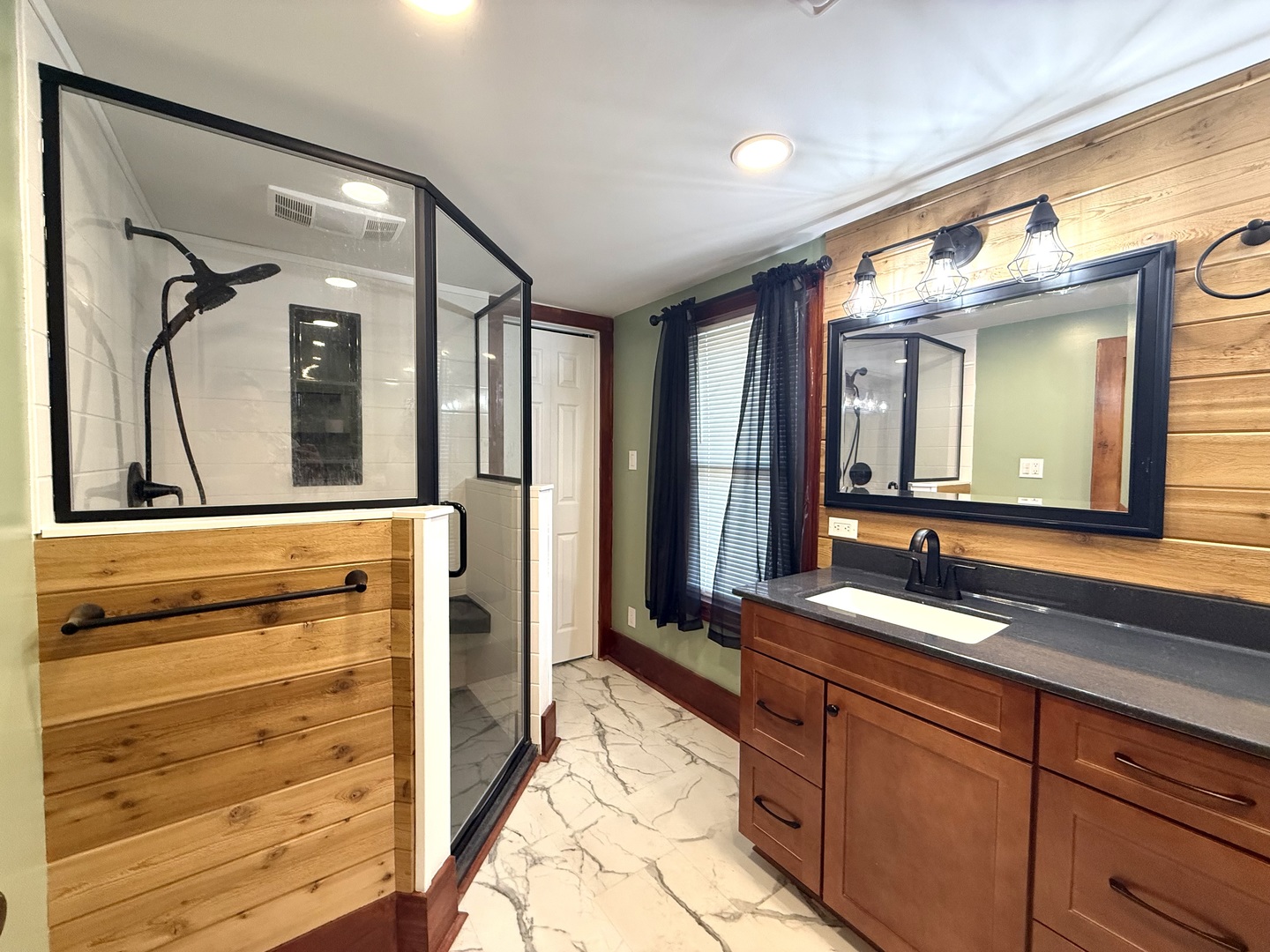 4799 South Center Road Rochelle, IL 61068 - Photo 18 of 30 a bathroom with a double vanity sink and a mirror