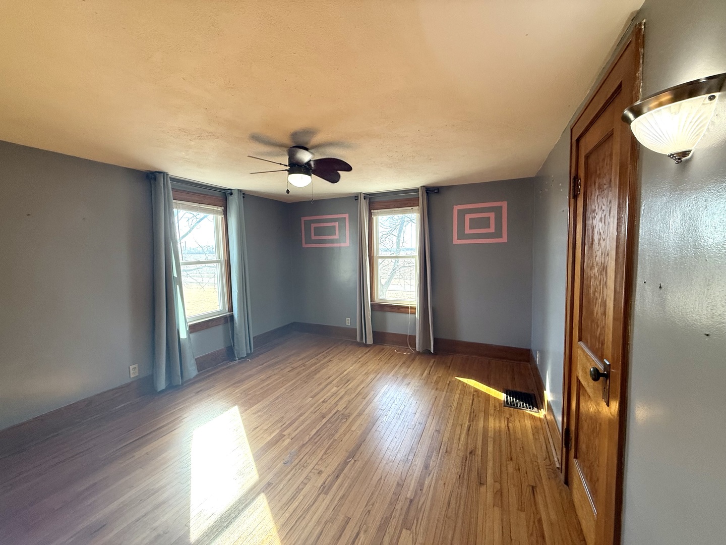 4799 South Center Road Rochelle, IL 61068 - Photo 22 of 30 an empty room with wooden floor and windows