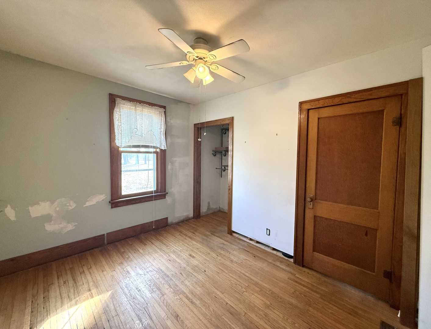 4799 South Center Road Rochelle, IL 61068 - Photo 24 of 30 a view of an empty room with wooden floor and a window