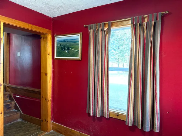 a view of a room with furniture and windows