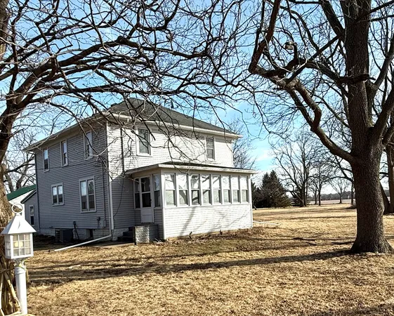 a view of a house with snow on the ground