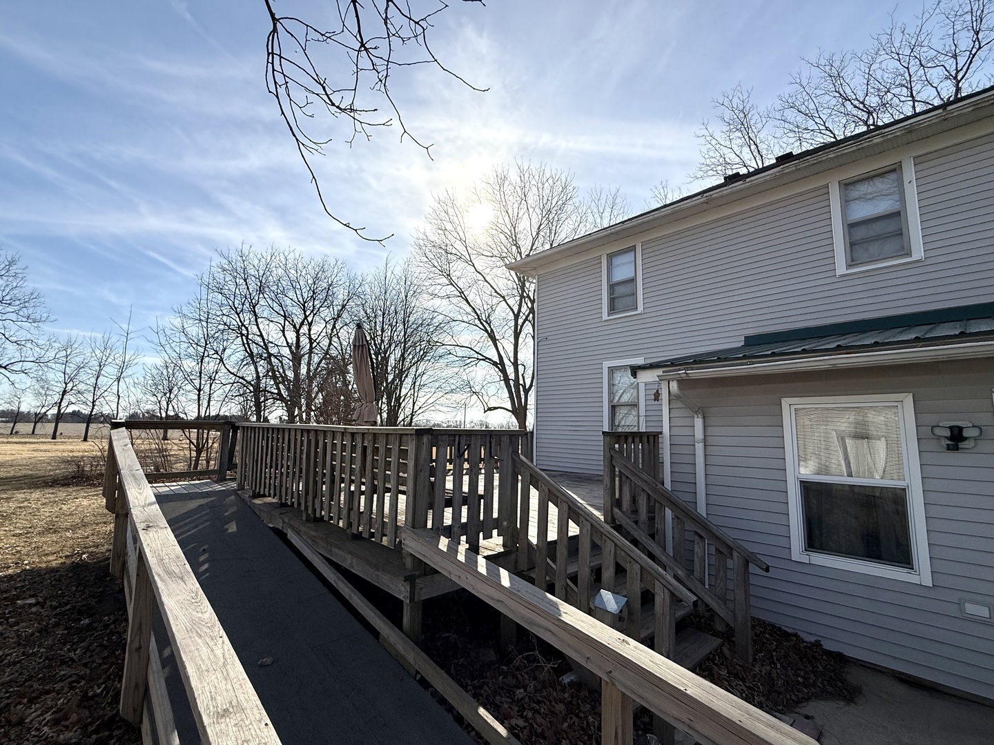 4799 South Center Road Rochelle, IL 61068 - Photo 5 of 30 a view of a roof deck with wooden floor and fence
